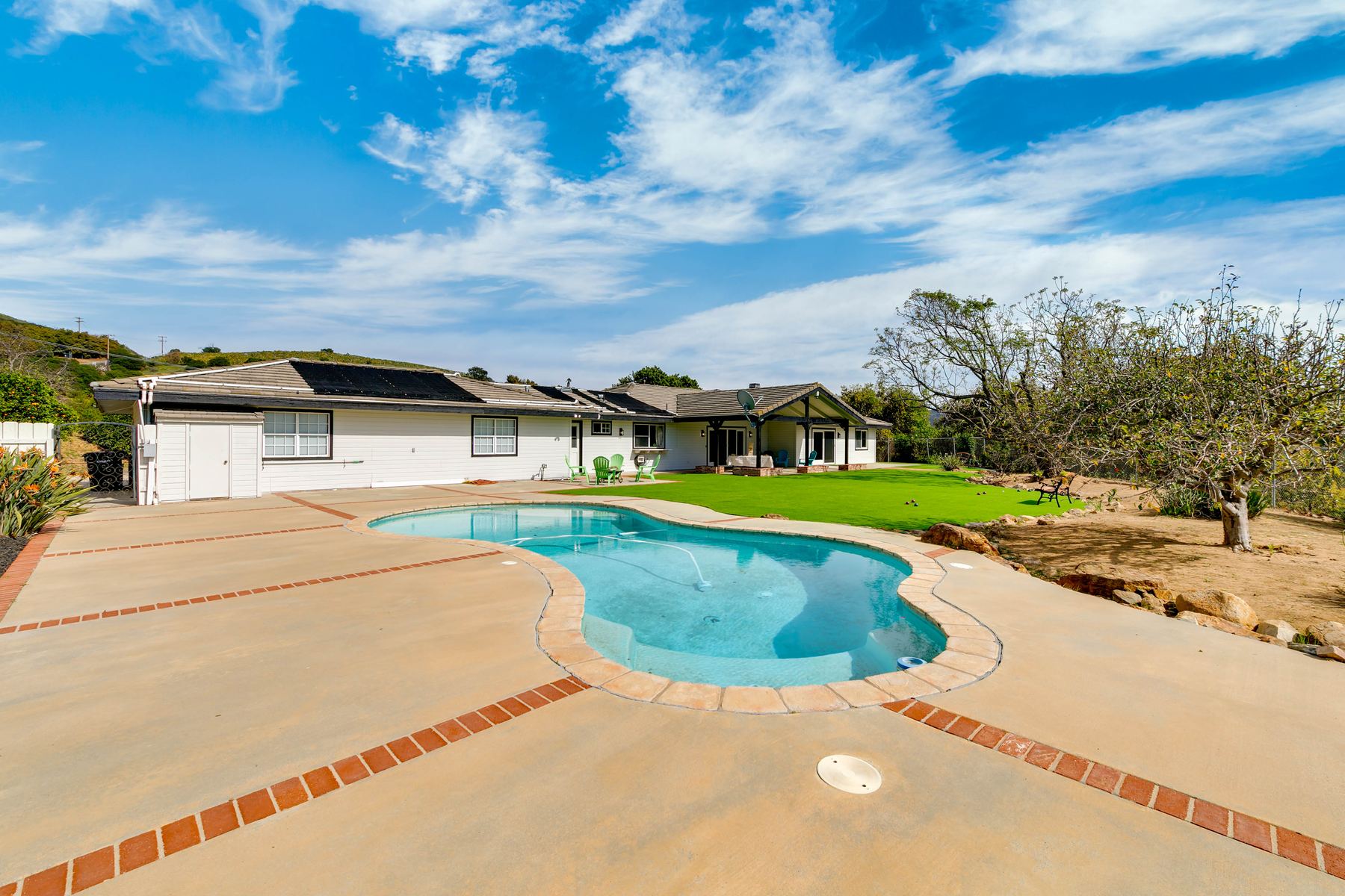 Private pool with hillside and orchard views